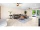 Bright living room with stylish furniture, ceiling fan, and access to the outdoor patio at 234 Winding Shore Rd, Troutman, NC 28166