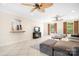 Spacious living area featuring tile flooring, a ceiling fan, and an open layout at 234 Winding Shore Rd, Troutman, NC 28166