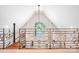Open loft area with wrought iron railing and vaulted ceiling at 234 Winding Shore Rd, Troutman, NC 28166