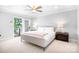 Calm main bedroom with private deck access and lake views at 234 Winding Shore Rd, Troutman, NC 28166