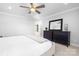 Comfortable main bedroom with ceiling fan and neutral décor at 234 Winding Shore Rd, Troutman, NC 28166