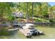 Stunning waterfront home featuring a private dock, boat, and serene lake views at 234 Winding Shore Rd, Troutman, NC 28166
