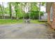 Expansive backyard featuring a patio, outdoor furniture, and lush greenery, perfect for outdoor entertaining and relaxation at 2429 Sugar Mill Rd, Charlotte, NC 28210
