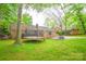 Spacious backyard featuring trampoline and outdoor seating at 2429 Sugar Mill Rd, Charlotte, NC 28210