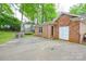 Outdoor space with a trampoline, brick exterior, and patio at 2429 Sugar Mill Rd, Charlotte, NC 28210