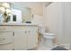 Bathroom featuring a white vanity, toilet, neutral tile floor, and shower with white curtain at 2429 Sugar Mill Rd, Charlotte, NC 28210