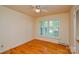 Bright bedroom with hardwood floors, large windows, and a ceiling fan at 2429 Sugar Mill Rd, Charlotte, NC 28210