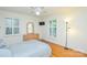 Cozy bedroom with hardwood floors, natural light, a dresser, and a queen-sized bed at 2429 Sugar Mill Rd, Charlotte, NC 28210