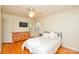 Cozy bedroom with light-colored walls, wooden floors, and ceiling fan at 2429 Sugar Mill Rd, Charlotte, NC 28210