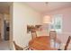 Bright dining area with a round table, stainless steel appliances, and natural light at 2429 Sugar Mill Rd, Charlotte, NC 28210