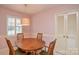 Cozy dining area with a wooden table set and natural light at 2429 Sugar Mill Rd, Charlotte, NC 28210