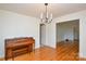 Open dining room featuring hardwood floors and a modern chandelier at 2429 Sugar Mill Rd, Charlotte, NC 28210