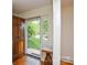 Bright foyer featuring hardwood floors and a view of the front yard through a glass front door at 2429 Sugar Mill Rd, Charlotte, NC 28210