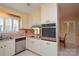Charming kitchen with stainless steel appliances and pink countertops at 2429 Sugar Mill Rd, Charlotte, NC 28210