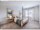 Serene bedroom features neutral walls, plush carpet, and a comfortable four-poster bed at 2555 Ruby Dixon Crossing Dr # 16, Gastonia, NC 28056