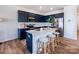 Modern kitchen boasts navy cabinets, quartz countertops, stainless steel appliances, and a center island at 2555 Ruby Dixon Crossing Dr # 16, Gastonia, NC 28056