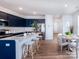 Modern kitchen includes a spacious island, stainless appliances, and adjacent dining area at 2555 Ruby Dixon Crossing Dr # 16, Gastonia, NC 28056