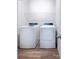 Bright laundry room with a modern washer and dryer set and overhead wire shelf at 2555 Ruby Dixon Crossing Dr # 16, Gastonia, NC 28056