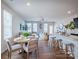 Open-concept living space includes dining area and breakfast bar with modern finishes and ample natural light at 2555 Ruby Dixon Crossing Dr # 16, Gastonia, NC 28056