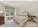 Inviting bedroom with natural light, a comfortable bed, complemented by a charming window seat and furnishings at 2616 Colton Dr, Charlotte, NC 28211
