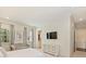 Bedroom with neutral decor, sitting area, and a view into an ensuite bathroom at 2616 Colton Dr, Charlotte, NC 28211