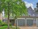 Charming home featuring a two-car garage, and shingle siding, set in a lush, landscaped neighborhood at 2616 Colton Dr, Charlotte, NC 28211
