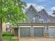 Charming home featuring a two-car garage, and shingle siding, set in a lush, landscaped neighborhood at 2616 Colton Dr, Charlotte, NC 28211