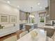 Elegant kitchen with gray cabinetry, quartz countertops, and stainless steel appliances at 2616 Colton Dr, Charlotte, NC 28211