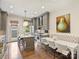 Eat-in kitchen with gray cabinets, a quartz island, and stainless steel appliances at 2616 Colton Dr, Charlotte, NC 28211