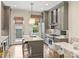Modern kitchen featuring gray cabinetry, a center island, and stainless steel appliances at 2616 Colton Dr, Charlotte, NC 28211