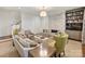 Stylish living room featuring a stone fireplace, built-in bookcase, and comfortable seating arrangement at 2616 Colton Dr, Charlotte, NC 28211