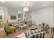 Spacious living room with neutral walls, stairs and stylish seating arrangement at 2616 Colton Dr, Charlotte, NC 28211
