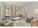 Bright living room with stylish furnishings and decor, featuring classic furniture and natural light from multiple windows at 2616 Colton Dr, Charlotte, NC 28211