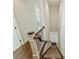 Staircase with hardwood stairs and a patterned runner, leading to the upper levels at 2616 Colton Dr, Charlotte, NC 28211