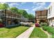 Charming backyard view of apartments with well-maintained landscaping and inviting outdoor spaces at 2630 Park Rd # H, Charlotte, NC 28209