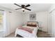 Comfortable bedroom with a ceiling fan, bedside tables, and neutral decor at 2630 Park Rd # H, Charlotte, NC 28209