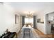 Cozy dining area featuring modern lighting, view to patio, and stylish decor at 2630 Park Rd # H, Charlotte, NC 28209