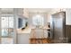 Charming kitchen with white cabinets, stainless steel appliances, and a view to the patio at 2630 Park Rd # H, Charlotte, NC 28209