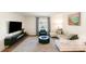 Bright living room with modern furnishings, large window, and stylish decor at 2630 Park Rd # H, Charlotte, NC 28209