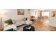 An airy living room with white sectional couch, natural light, and open dining area at 2630 Park Rd # H, Charlotte, NC 28209