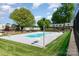 Community pool surrounded by lush green grass, perfect for outdoor recreation and relaxation at 2630 Park Rd # H, Charlotte, NC 28209