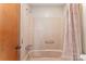 Bathroom shower and tub with a pink shower curtain and a door at 2643 Providence Dr, Gastonia, NC 28052