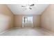 Neutral bedroom with plush carpeting, a ceiling fan, and natural light at 2643 Providence Dr, Gastonia, NC 28052