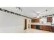 Kitchen with floral wallpaper, wood cabinets, and classic appliances at 2643 Providence Dr, Gastonia, NC 28052