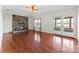 Bright living room with hardwood floors, stone fireplace, and patio doors at 2643 Providence Dr, Gastonia, NC 28052
