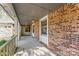 Covered porch with brick columns and railing, offering a welcoming entrance at 2643 Providence Dr, Gastonia, NC 28052