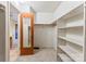 Walk-in closet with shelving and clothing rack for organized storage at 2643 Providence Dr, Gastonia, NC 28052