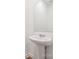 Modern pedestal sink with chrome hardware and large mirror in half bath at 285 Bezelle Ave, York, SC 29745