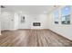 Open living room with hardwood floors, fireplace, and ample natural light at 285 Bezelle Ave, York, SC 29745