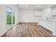 Bright living room with hardwood floors and sliding glass door leading to yard at 285 Bezelle Ave, York, SC 29745